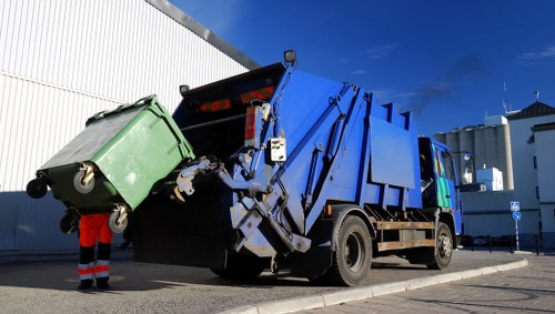 Business professionals managing waste in a West London office