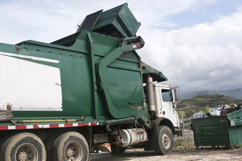 Waste collection truck navigating West London streets